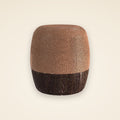 ambielo — a rounded barrel of woven copper on a walnut base